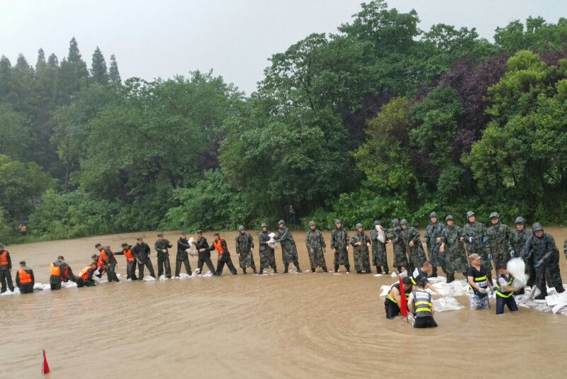 Chinese Premier Li Keqiang joins disaster relief efforts in heavy rain in Wuhan, in central China