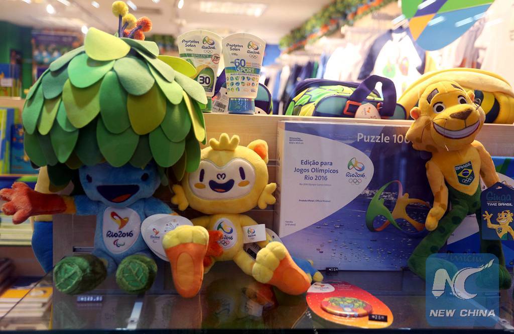 Souvenirs and other products are displayed at a showcase of an official store of Rio 2016 Olympic Games, in Galeao International Airport, in Rio de Janeiro, Brazil, on Feb. 25, 2016. (Xinhua/Rahel Patrasso)