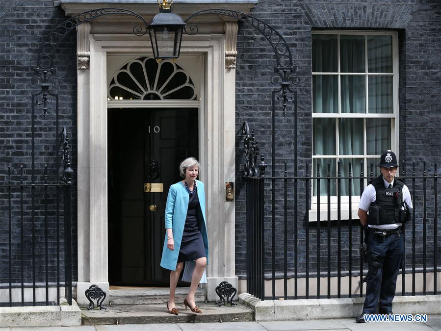 LONDON, July 11, 2016 (Xinhua) -- File photo taken on June 27, 2016 shows British Home Secretary Theresa May (L) leaving after a cabinet meeting at 10 Downing Street in London, Britain. British Home Secretary Theresa May, the only remaining contender in the Tory leadership bid, is to become the new prime minister by Wednesday evening, Prime Minister David Cameron announced Monday. (Xinhua/Han Yan)