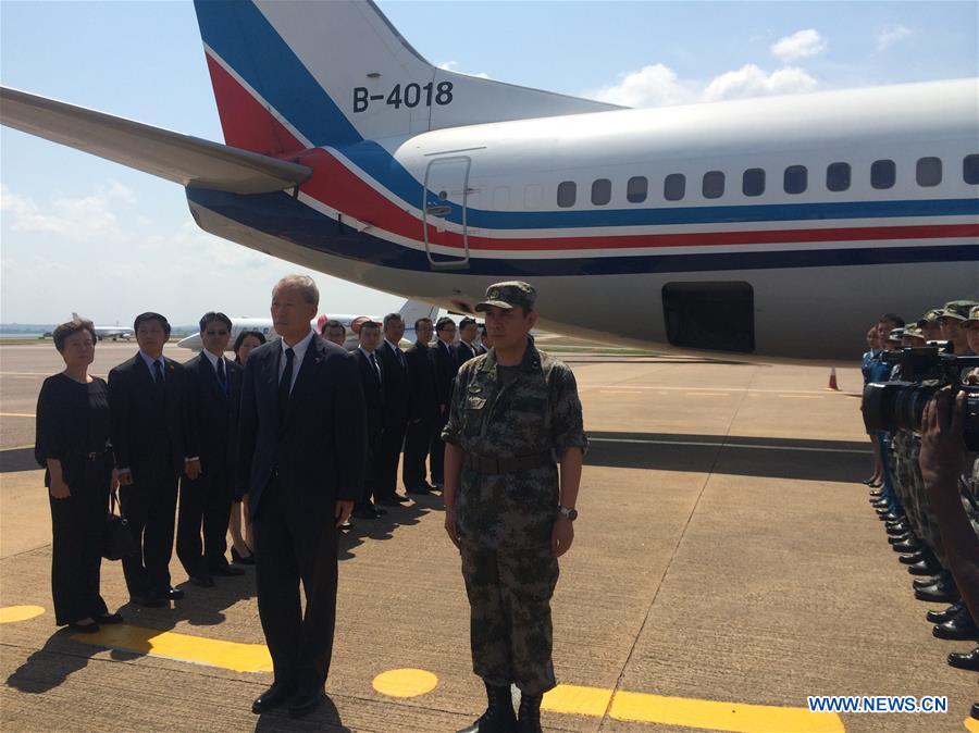 Representatives from Chinese military team and Chinese embassy in Uganda attend a ceremony before moving Chinese peacekeepers