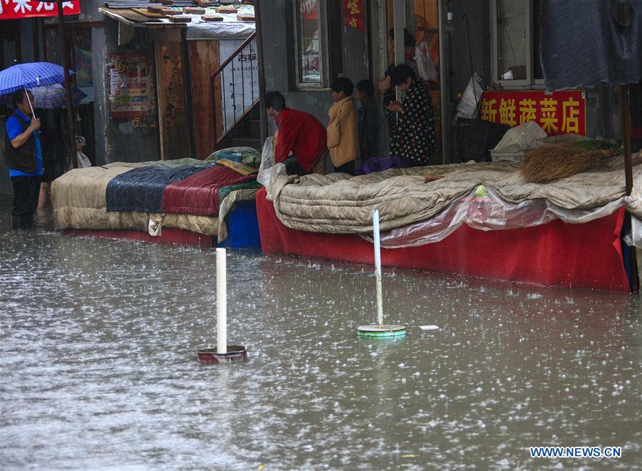 TAIYUAN, July 19, 2016 (Xinhua) -- A booth is submerged in a market in Taiyuan, capital of north China