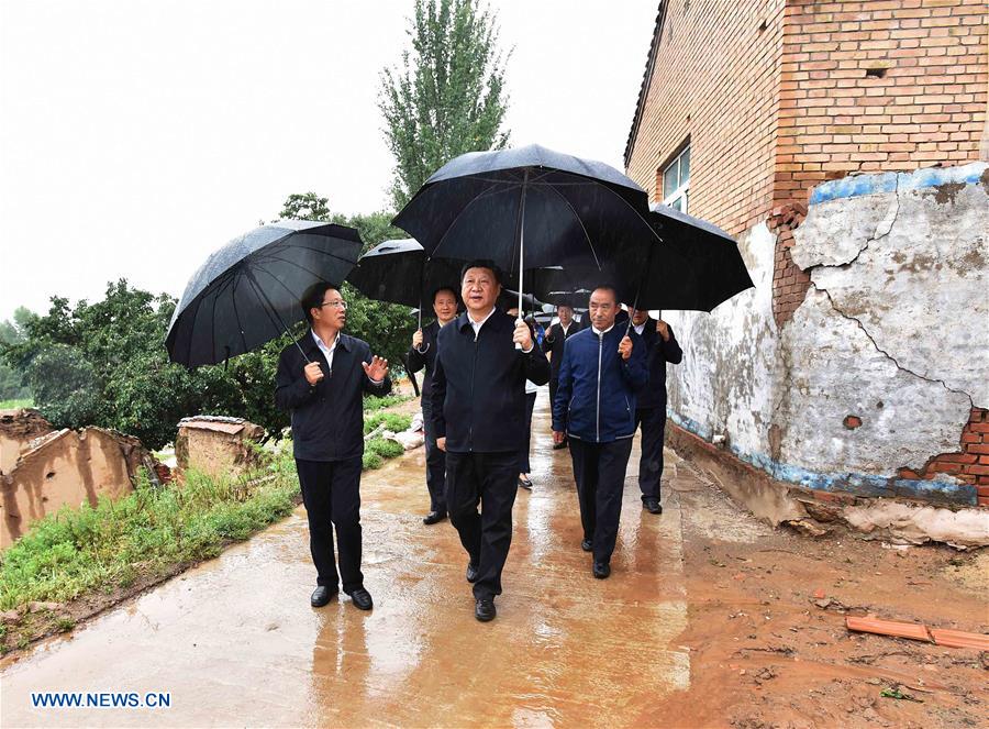 YINCHUAN, July 20, 2016 (Xinhua) -- Chinese President Xi Jinping visits Yangling Village on studying poverty relief work in Dawan Town of Guyuan City, northwest China