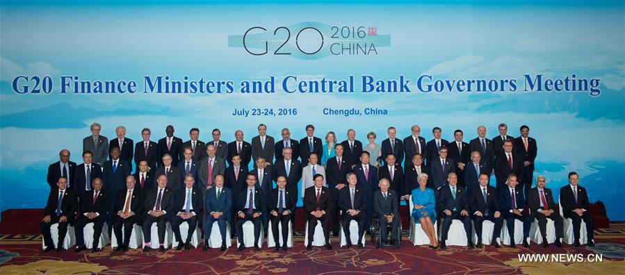  Participants pose for a group photo during a meeting of G20 finance ministers and central bank governors in Chengdu, capital of southwest China
