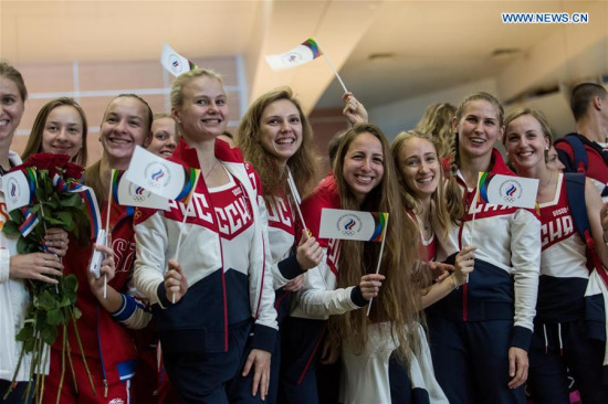 MOSCOW, July 28, 2016 (Xinhua) -- Russian athletes bid farewell to people at the Sheremetyevo airport in Moscow, Russia, July 28, 2016. About 70 Russian athletes left Moscow on Thursday for Rio de Janeiro to take part in the Rio 2016 Olympic Games. Those athletes are from Russian national teams of volleyball, handball, boxing, table tennis, synchronised swimming and equestrian. (Xinhua/Evgeny Sinitsyn)