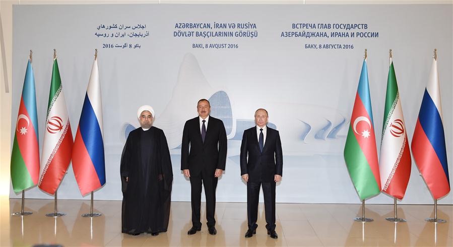 Iranian President Hassan Rouhani (L), Azerbaijani President Ilham Aliyev (C) and Russian President Vladimir Putin pose for a group photo during a trilateral meeting in Baku, Azerbaijan, Aug. 8, 2016. The meeting is expected to focus on trade, energy, communications, transportation, environment as well as the Syrian situation and the Islamic State threat to Russia. (Xinhua/AZERTAC)