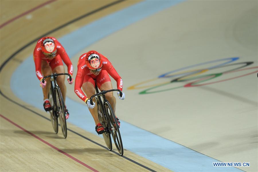 Zhong Tianshi (L) of China competes during the final of women