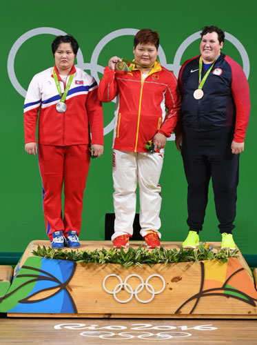 Kuk Hyang Kim of DPRK, Meng Suping of China, and Sarah Robles of USA pose with their medals. [Photo/Xinhua]
