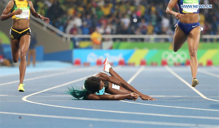  Shaunae Miller of Bahamas (C) falls during the women
