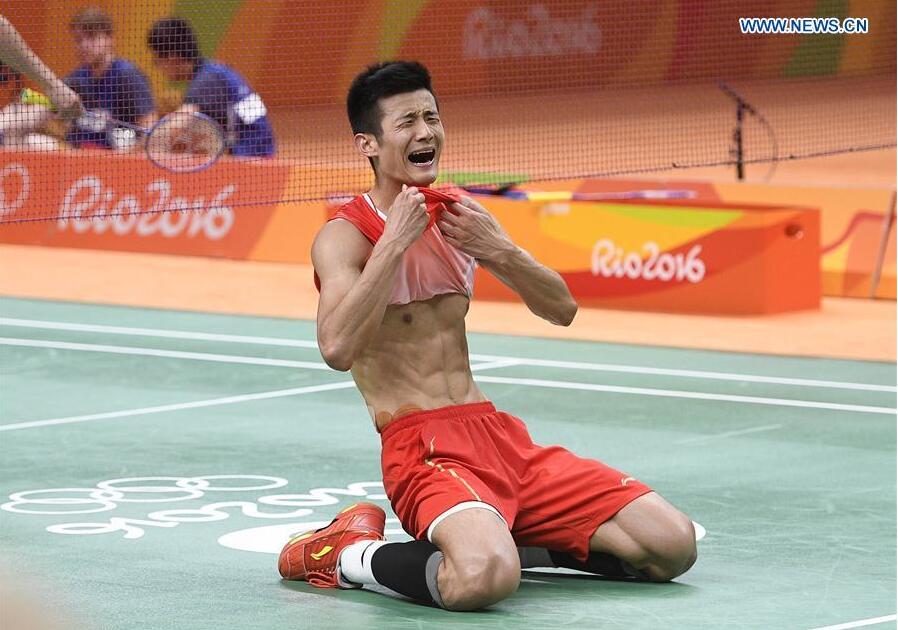Chen Long of China celebrates his victory over Lee Chong Wei of Malaysia during the men