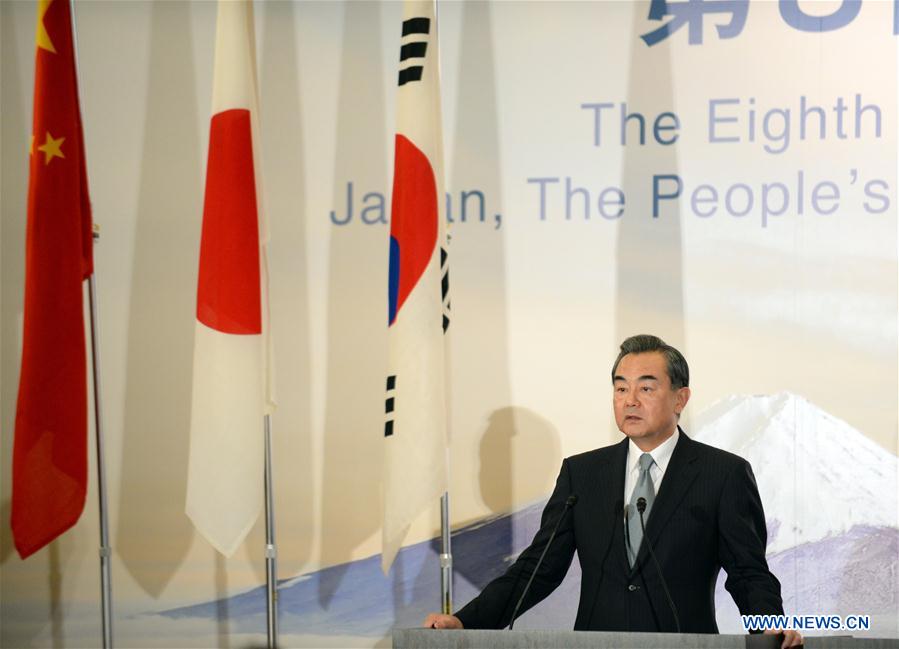 Chinese Foreign Minister Wang Yi speaks during a joint press conference in Tokyo, Japan, Aug. 24, 2016. The 8th trilateral foreign ministers