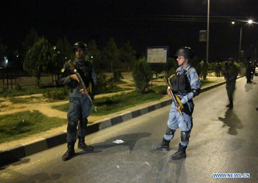 Afghan policemen stand guard at the attack site in Kabul, capital of Afghanistan, Aug. 24, 2016. At least one student was killed and nearly 20 persons injured after a car bombing and ensuing gunshots rocked a private college in the Afghan capital of Kabul on Wednesday evening, sources said. (Xinhua/Rahmat Alizadah) 