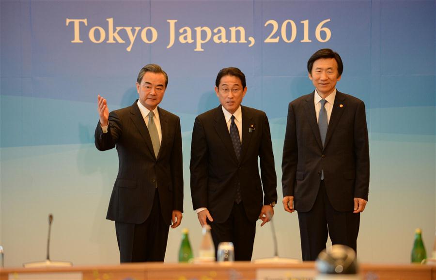 Chinese Foreign Minister Wang Yi, Japanese Foreign Minister Fumio Kishida and South Korean Foreign Minister Yun Byung-se (from L to R) attend the 8th trilateral foreign ministers