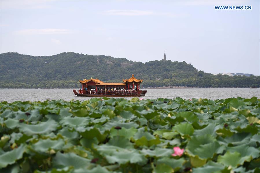 Photo taken on Aug. 27, 2016 shows a sightseeing boat on the West Lake in Hangzhou, capital city of east China