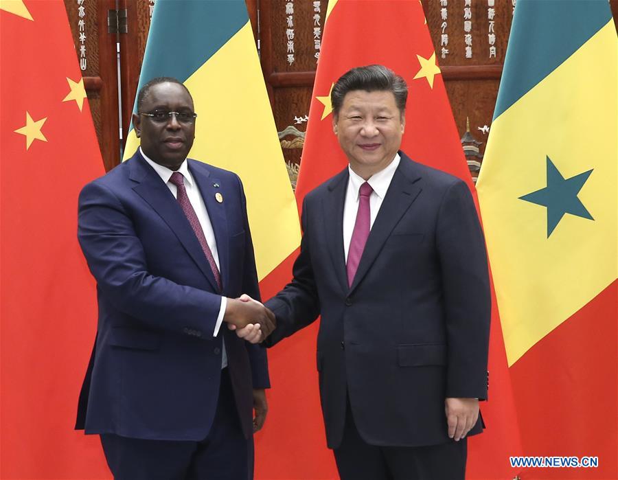 Chinese President Xi Jinping (R) meets with his Senegalese counterpart Macky Sall in Hangzhou, capital of east China