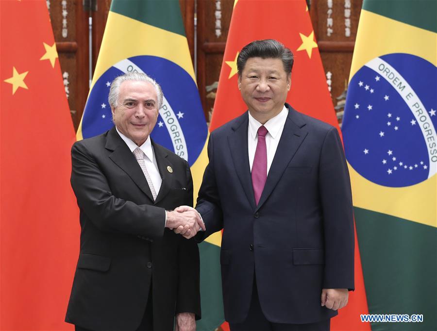 Chinese President Xi Jinping (R) meets with his Brazilian counterpart Michel Temer, who is here to attend the G20 summit, in Hangzhou, capital city of east China