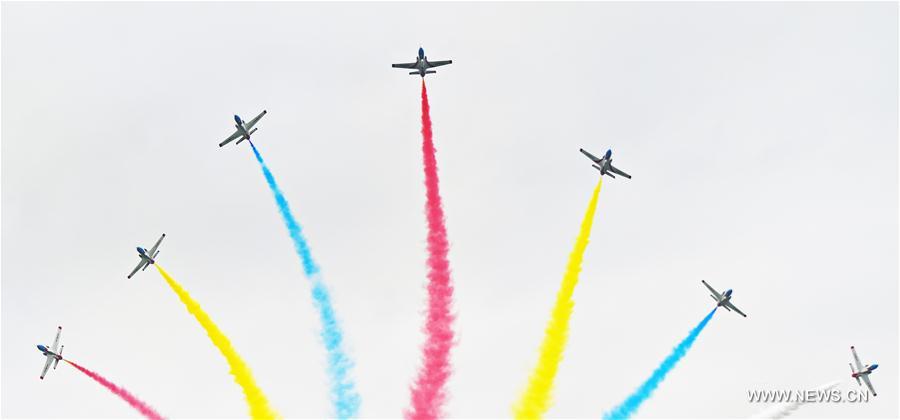 The Red Falcon Air Demonstration Team performs in the sky during the PLA Air Force Aviation Open Day in Changchun, capital city of northeast China