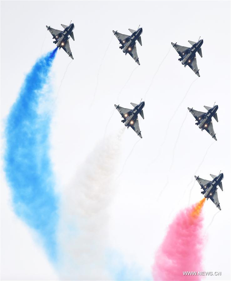 The Bayi Aerobatics Team performs in the sky during the PLA Air Force Aviation Open Day in Changchun, capital city of northeast China