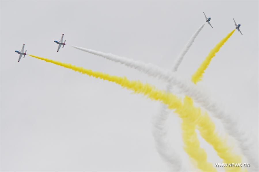 The Red Falcon Air Demonstration Team performs in the sky during the PLA Air Force Aviation Open Day in Changchun, capital city of northeast China