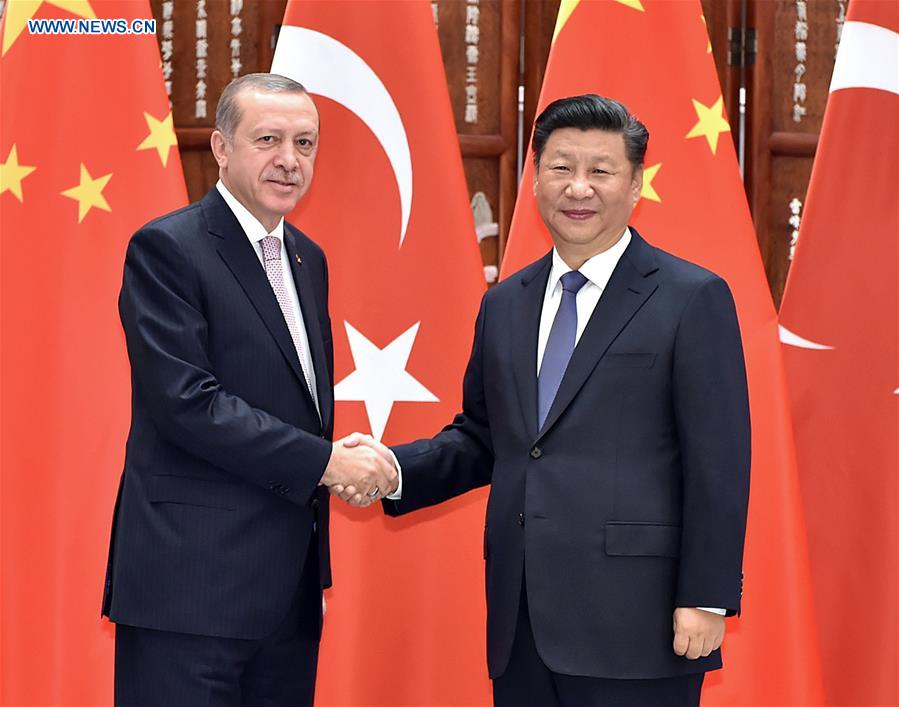 Chinese President Xi Jinping (R) meets with his Turkish counterpart Recep Tayyip Erdogan who came to Hangzhou to attend the G20 Summit in Hangzhou, capital city of east China