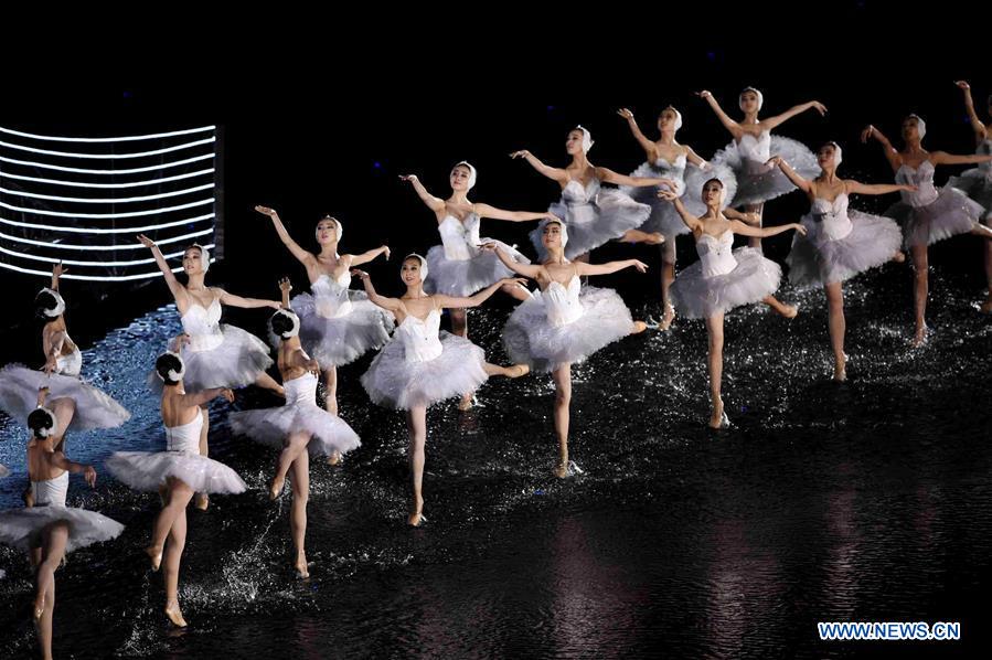 Artists dance during an evening gala for the G20 summit at the West Lake scenic zone in Hangzhou, capital of east China