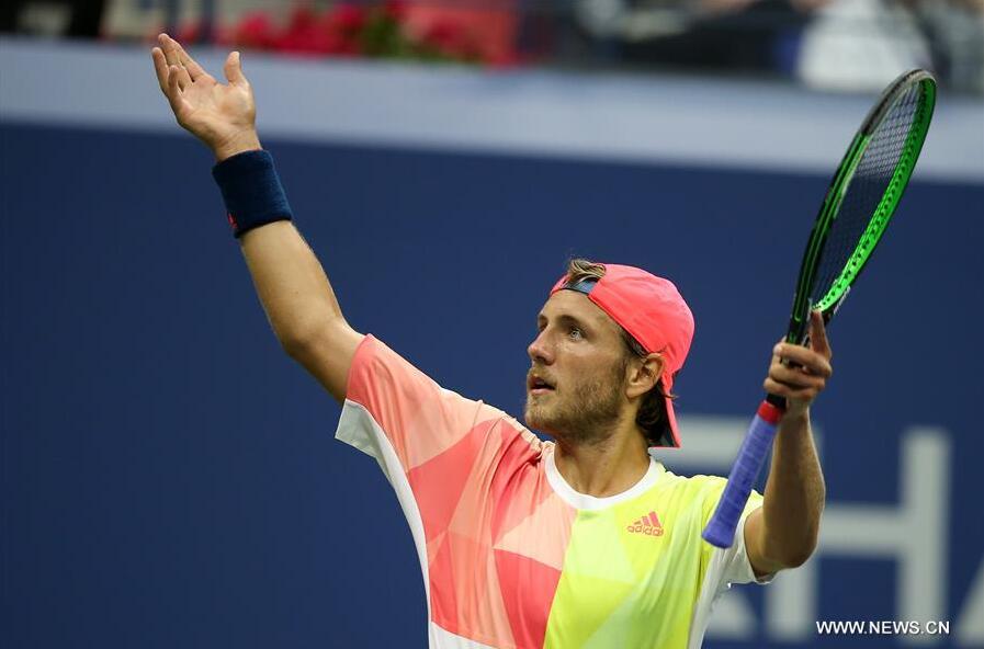 Lucas Pouille of France celebrates scoring during a men