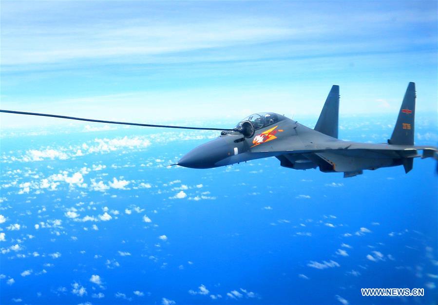 A Chinese Air Force Su-30 fighter is refueled during a routine combat simulation drill over the West Pacific Sept. 12, 2016. The Chinese Air Force on Monday sent multiple aircraft models, including H-6K bombers, Su-30 fighters, and air tankers, for the drill. The fleet conducted reconnaissance and early warning, sea surface cruising, inflight refueling, and achieved all the drill