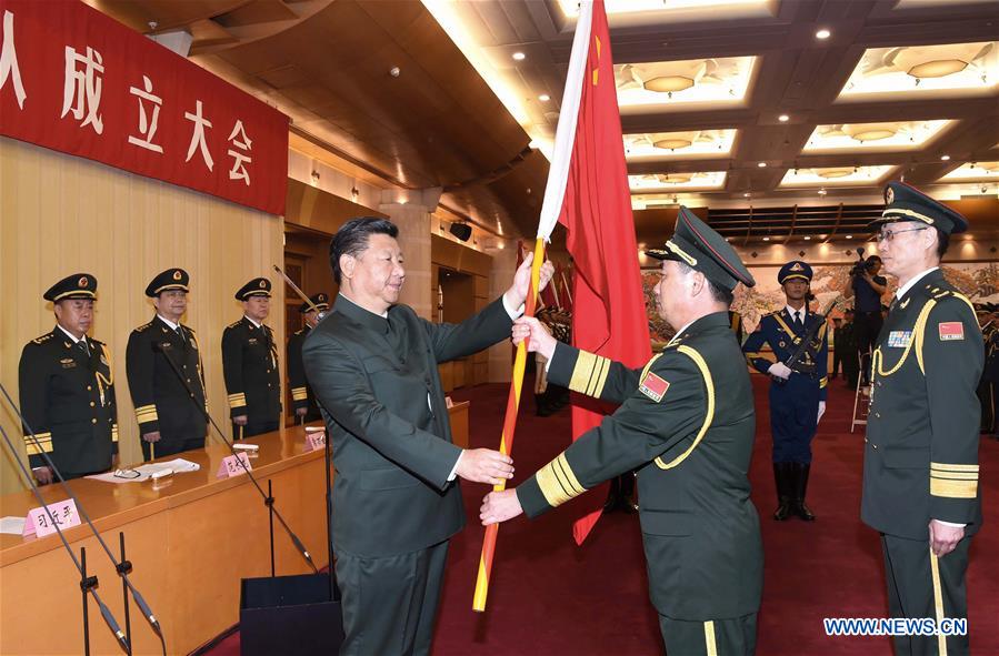 Chinese President Xi Jinping(L, front), also general secretary of the Communist Party of China (CPC) Central Committee and chairman of the Central Military Commission (CMC), confers a military flag to Commander Li Shisheng and Political Commissar Yin Zhihong of Wuhan Joint Logistics Unit as the CMC established a joint logistics support force in Beijing, capital of China, Sept. 13, 2016. (Xinhua/Li Gang)