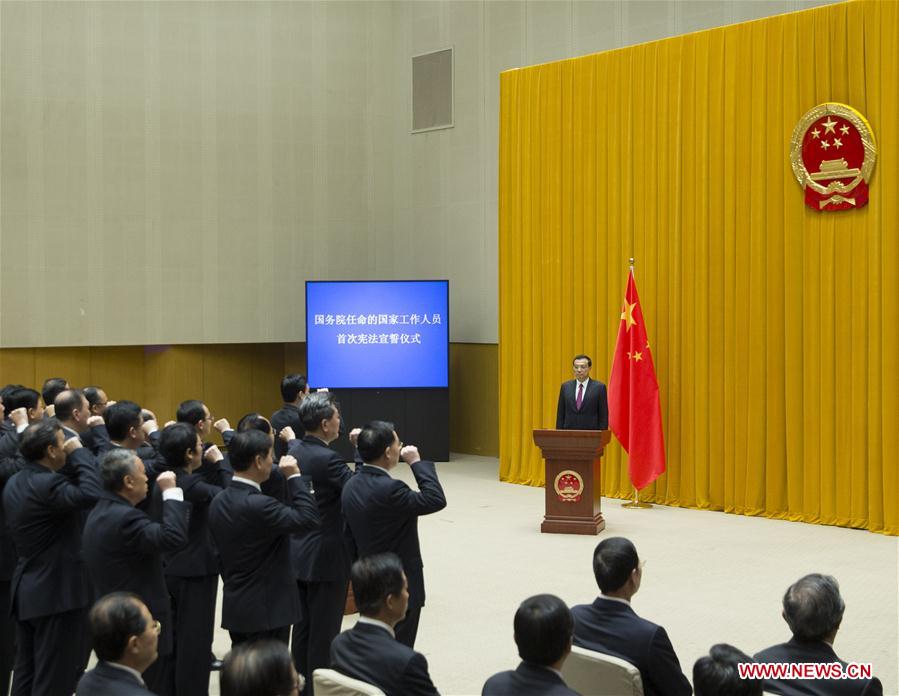 The State Council holds a ceremony for 55 officials to pledge fidelity to the Constitution at Zhongnanhai leadership compound in Beijing, capital of China, Sept. 18, 2016. In the first such ceremony, 55 newly-appointed leading officials from agencies directly under the State Council took the oath. The officials pledged to loyally defend the Constitution as they fulfill their duties honestly, subject to the people