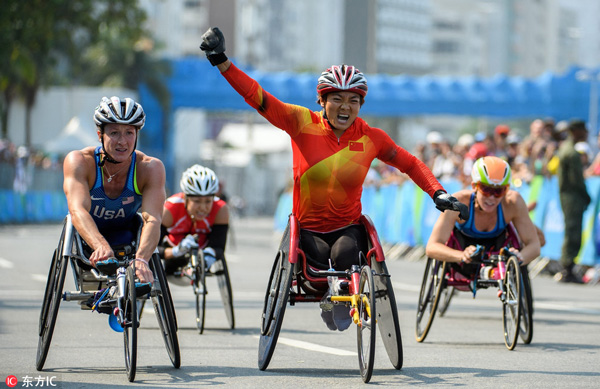 Zou Lihong of China, center, wins the gold medal in the event ahead of silver medalist Tatyana McFadden of the United States, left, during the Women