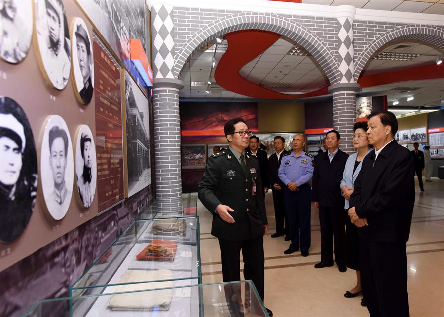 Liu Yunshan (R, front), a member of the Standing Committee of the Political Bureau of the Communist Party of China (CPC) Central Committee, visits an exhibition marking the 80th anniversary of the end of the Long March in Beijing, capital of China, Sept. 23, 2016. Chinese President Xi Jinping and other senior leaders Yu Zhengsheng, Liu Yunshan, Wang Qishan and Zhang Gaoli visited the exhibition here on Friday. (Xinhua/Rao Aimin)