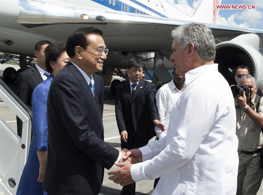 Chinese Premier Li Keqiang (L Front) and his wife Cheng Hong are welcomed by Miguel Diaz-Canel, Cuba