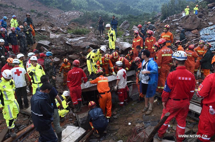 Rescuers search for survivors after a landslide hit Suichang County, east China