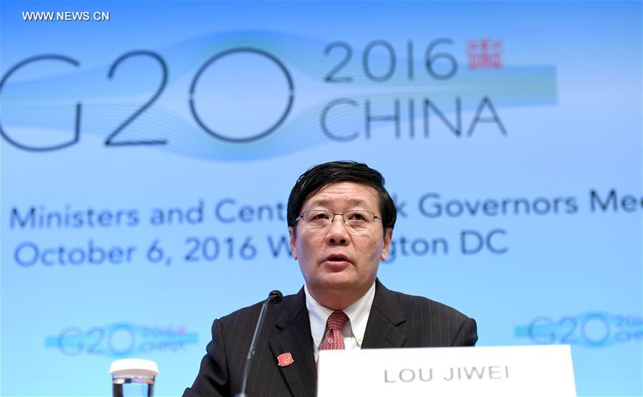 Chinese Finance Minister Lou Jiwei speaks at a press conference on G20 Finance Ministers and Central Bank Governors Meeting at the headquarters of International Monetary Fund(IMF) in Washington D.C., the United States, Oct. 7, 2016. Global economy continued to face uncertainty and rising risks, Lou Jiwei said on behalf of the G20 economies on Friday. (Xinhua/Yin Bogu)