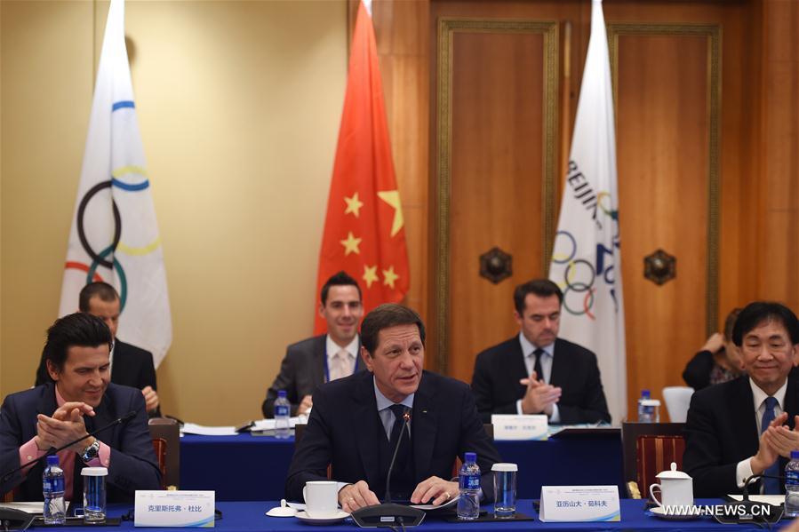 IOC Coordination Commission Chairman Alexander Zhukov (C front) speaks during the 1st Meeting of the IOC Coordination Commission for the XXIV Olympic Winter Games Beijing 2022 in Beijing, capital of China, Oct. 10, 2016. (Xinhua/Ju Huanzong) 