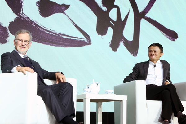 Steven Spielberg, chairman of Amblin Partners, and Jack Ma, chairman of Alibaba Group, attend an event to announce a partnership in Beijing on Sunday. [Photo provided to China Daily]