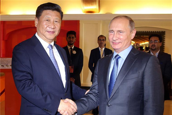 Chinese President Xi Jinping meets with Russian President Vladimir Putin in the western Indian state of Goa, Oct. 15, 2016.