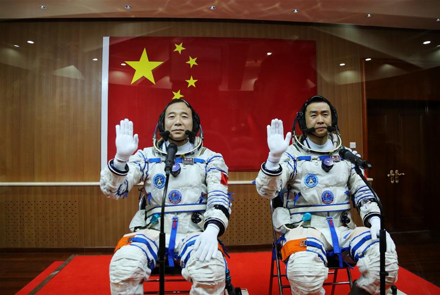 Taikonauts Jing Haipeng (L) and Chen Dong attend the see-off ceremony of the Shenzhou-11 manned space mission at the Jiuquan Satellite Launch Center in Jiuquan, northwest China
