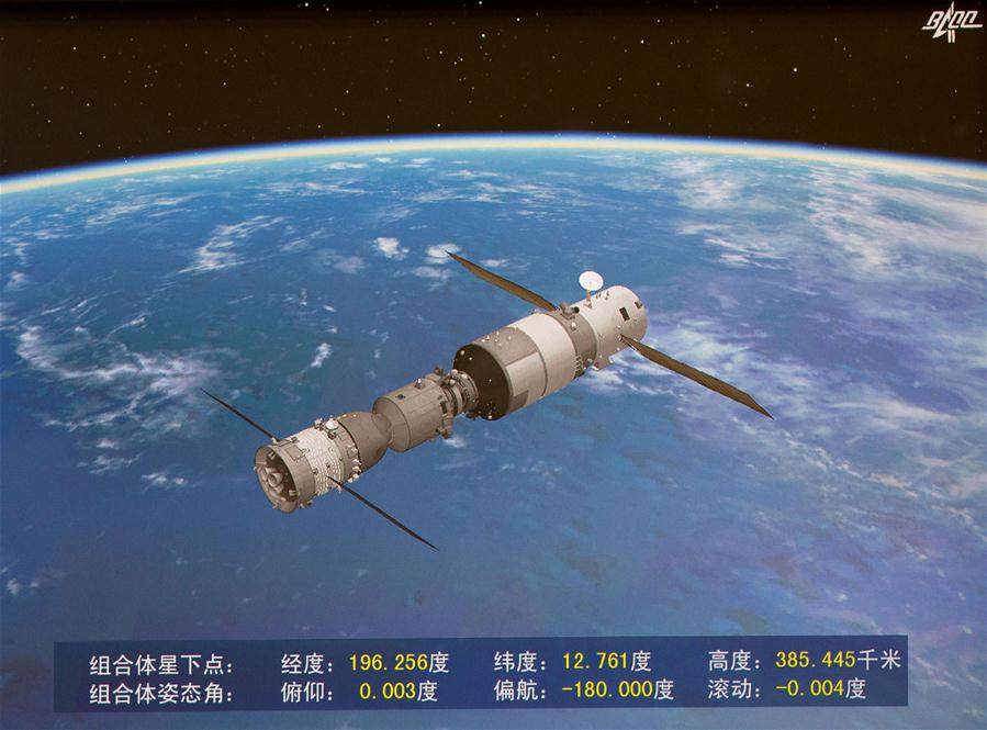 Photo taken on Oct. 19, 2016 shows the screen at the Beijing Aerospace Control Center showing a simulated picture of an automated docking between the Shenzhou-11 manned spacecraft and the orbiting space lab Tiangong-2. The Shenzhou-11 manned spacecraft successfully completed its automated docking with the orbiting Tiangong-2 space lab Wednesday morning, according to Beijing Aerospace Control Center. (Xinhua/Ju Zhenhua)