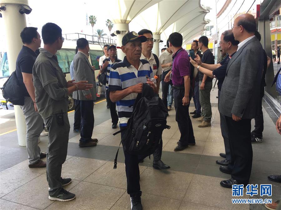 One of the Chinese sailors arrives at Kenyatta International Airport in Nairobi, Kenya, on Sunday. Nine out of the ten Chinese crew members freed by Somali pirates took a flight home on Monday from the Kenyan capital Nairobi, accompanied by officials sent from Beijing. (Photo/Xinhua)