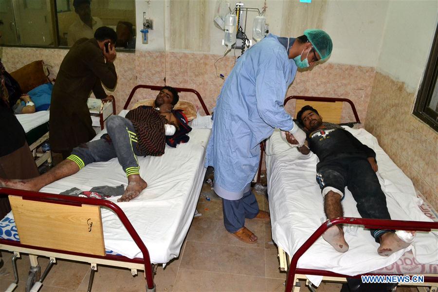 Injured personnel receive medical treatment at a hospital in southwest Pakistan