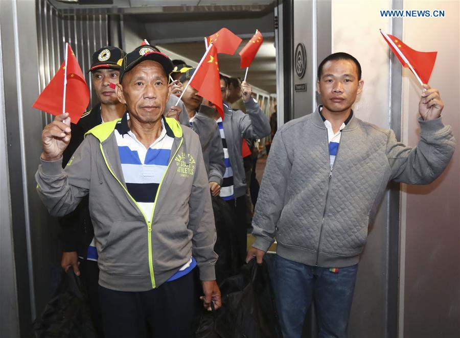 Rescued Chinese crew members held captive by Somali pirates for years arrive at Baiyun International Airport in Guangzhou, capital of south China
