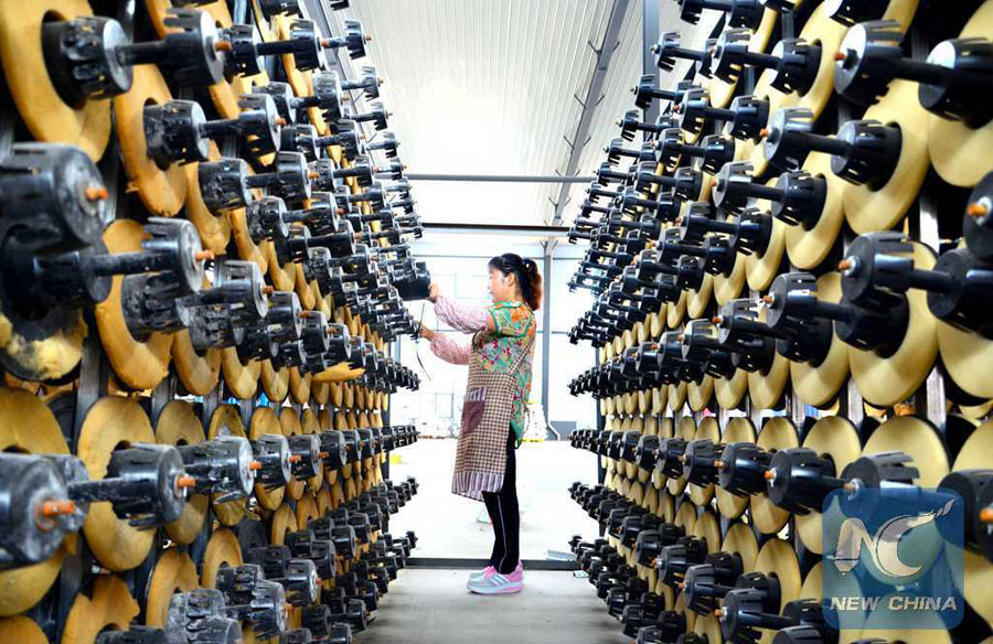 A worker works at a medical plastic factory in Yiyuan County, east China