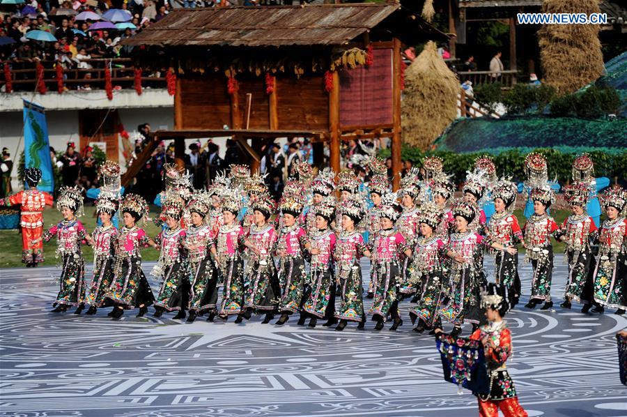 People of Miao ethnic group perform during a fair to celebrate their new year in Leishan, southwest China