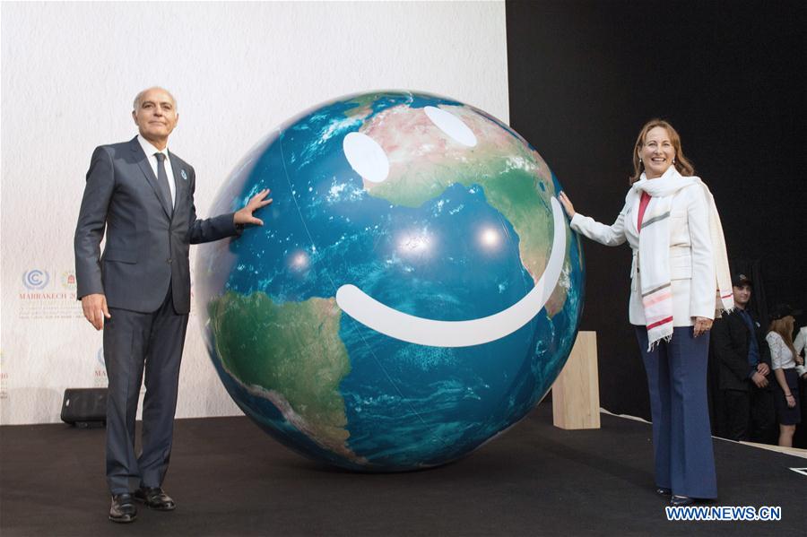 COP21 president Segolene Royal (R) and Morocco