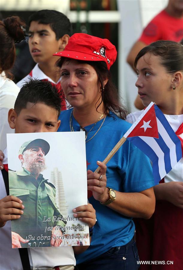 People bid farewell to the motorcade escorting the ashes of Cuban revolutionary leader Fidel Castro, as it leaves for its journey across the island in the province of Santa Clara, Cuba, on Dec. 1, 2016. Castro