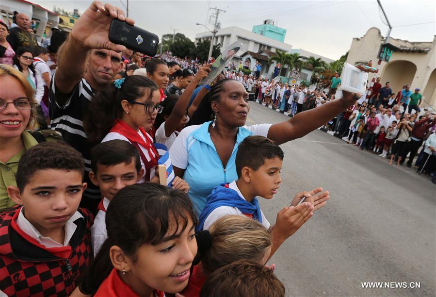 People bid farewell to the motorcade escorting the ashes of Cuban revolutionary leader Fidel Castro, as it leaves for its journey across the island in the province of Santa Clara, Cuba, on Dec. 1, 2016. Castro