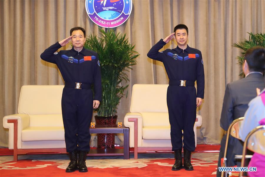 The two astronauts Jing Haipeng (L) and Chen Dong who manned China