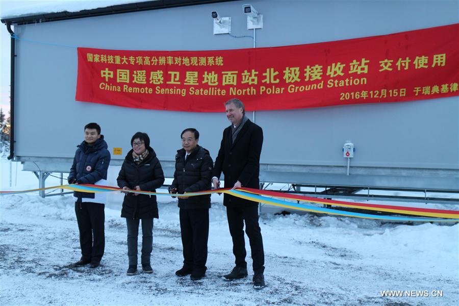 People attend a delivery ceremony for the China Remote Sensing Satellite North Pole Ground Station in Kiruna, Sweden, Dec. 15, 2016. The China Remote Sensing Satellite North Pole Ground Station has begun trial operations in Kiruna in Sweden, the Chinese Academy of Sciences (CAS) said Thursday. The station is China