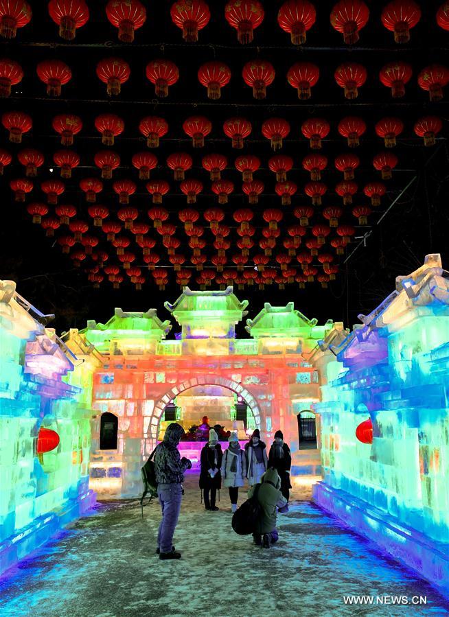 People enjoy lanterns during the 43rd Ice Lantern Exhibition in Harbin, capital of northeast China
