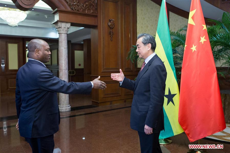 Chinese Foreign Minister Wang Yi (R) holds talks with his counterpart of Sao Tome and Principe Urbino Botelho in Beijing, capital of China, Dec. 26, 2016. (Xinhua/Cui Xinyu)